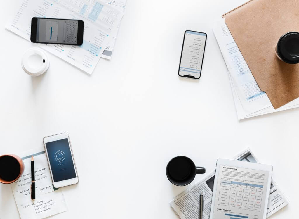 Phones and papers on desk at work.