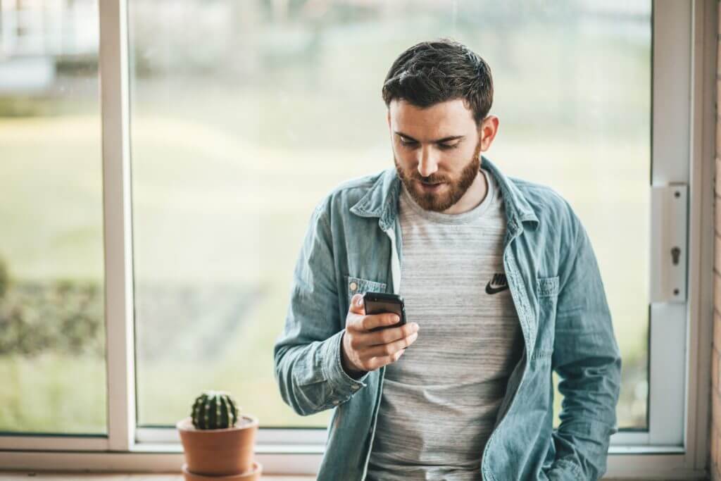 Man reading survey on phone.