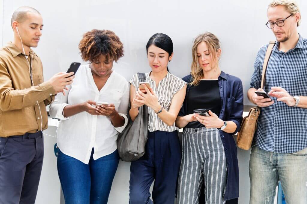 Adults reading on their phones.