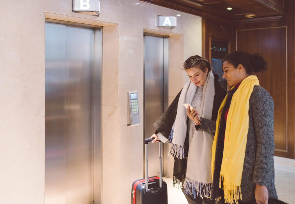 Business women waiting for hotel elevator