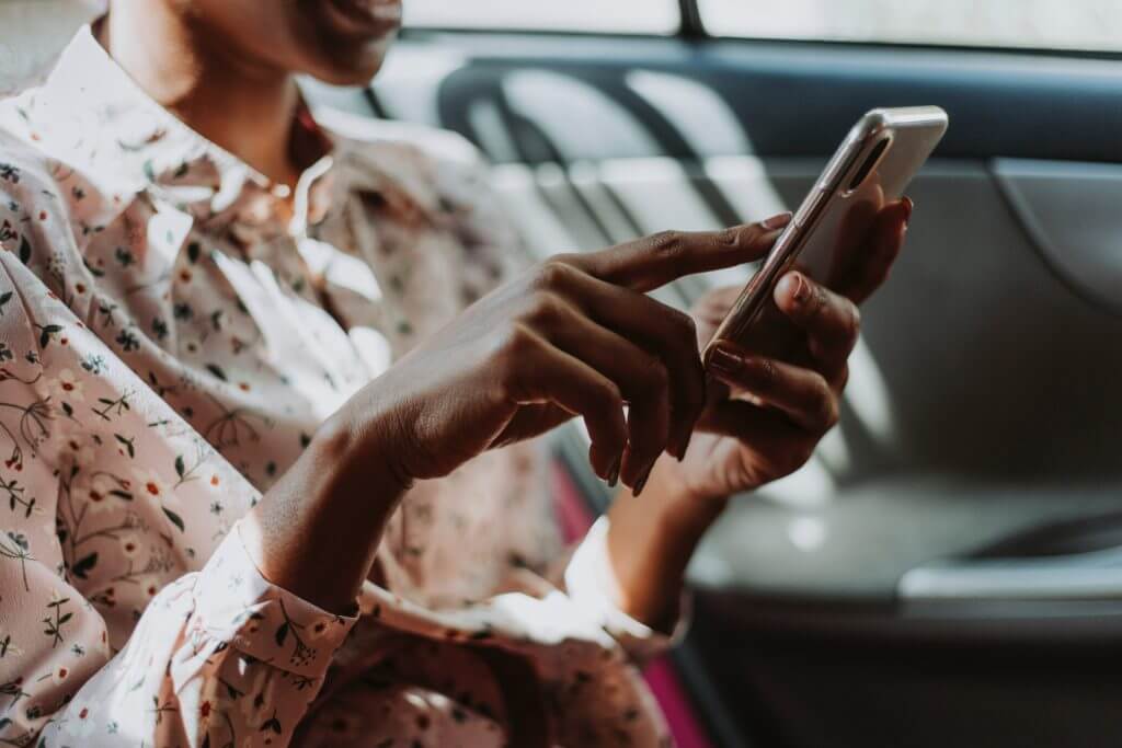 Women checking business SMS from phone.