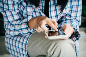 Woman texting from phone.