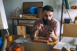 Man tracking delivery on smartphone.