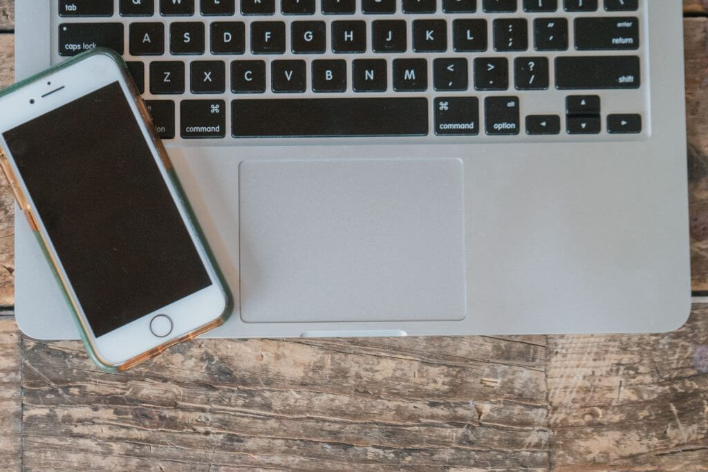 Mobile phone with laptop and keyboard.