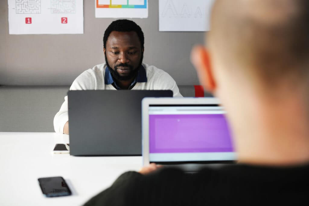 Business people working at computers.