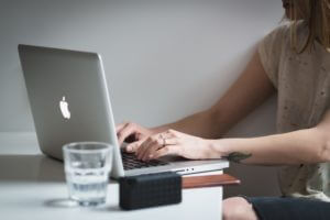 Person working on computer at desk.