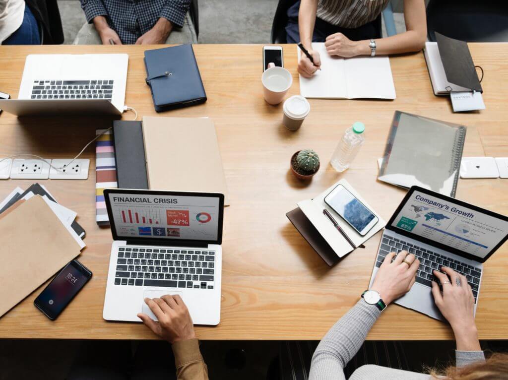 Startup employees working at desk.