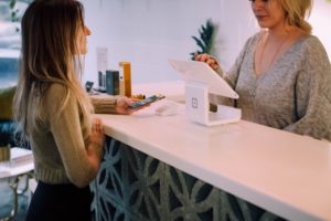 Woman paying at retailer