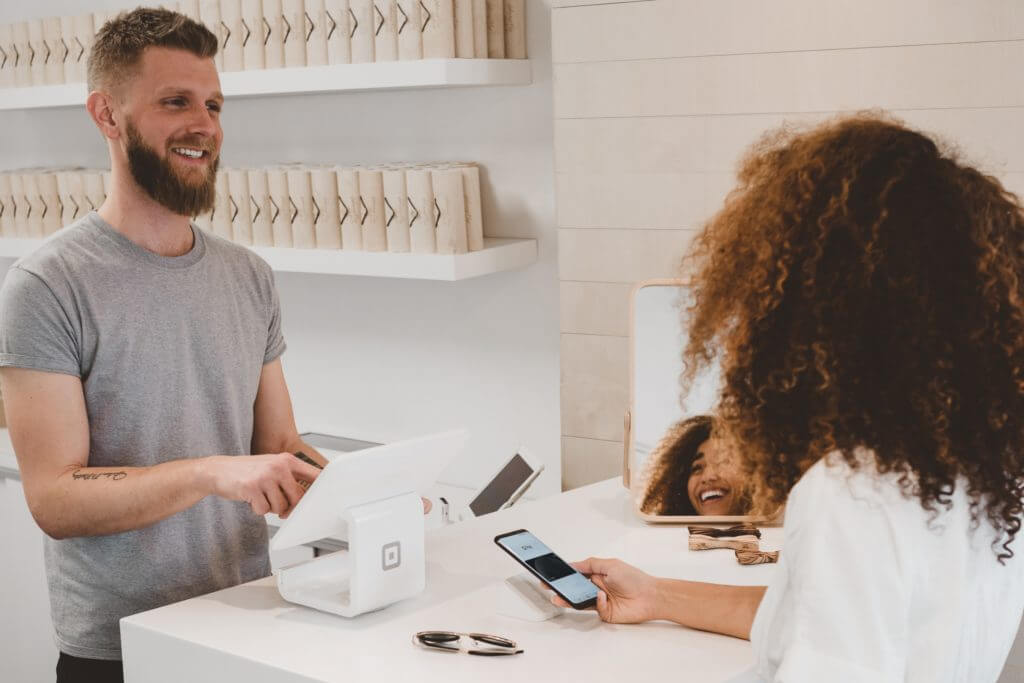 Client paying at salon.