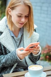 Woman texting on phone.