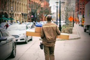 Delivery person walking to next location.