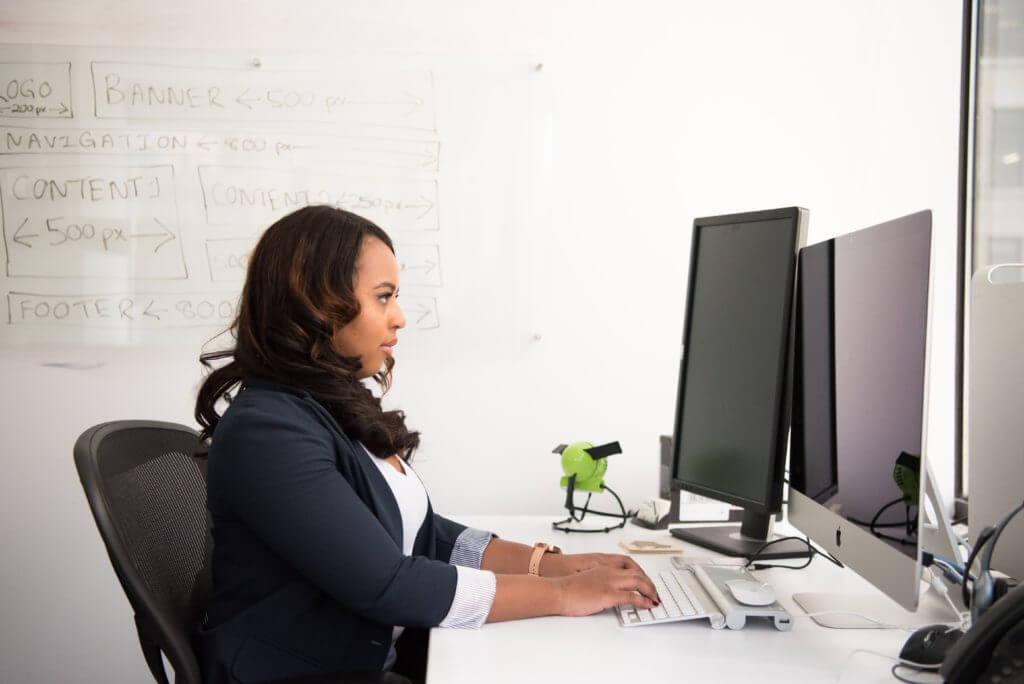 Businesswoman working at desk with computer