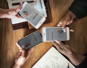 Business people holding smartphones