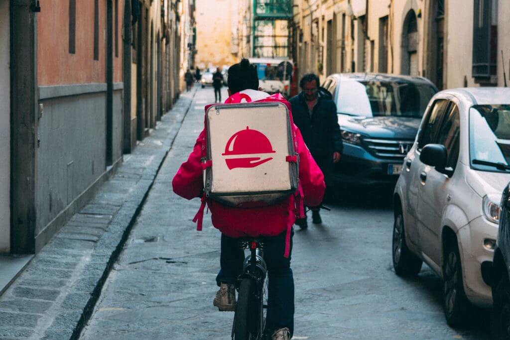 Dispatch delivery person on bike.