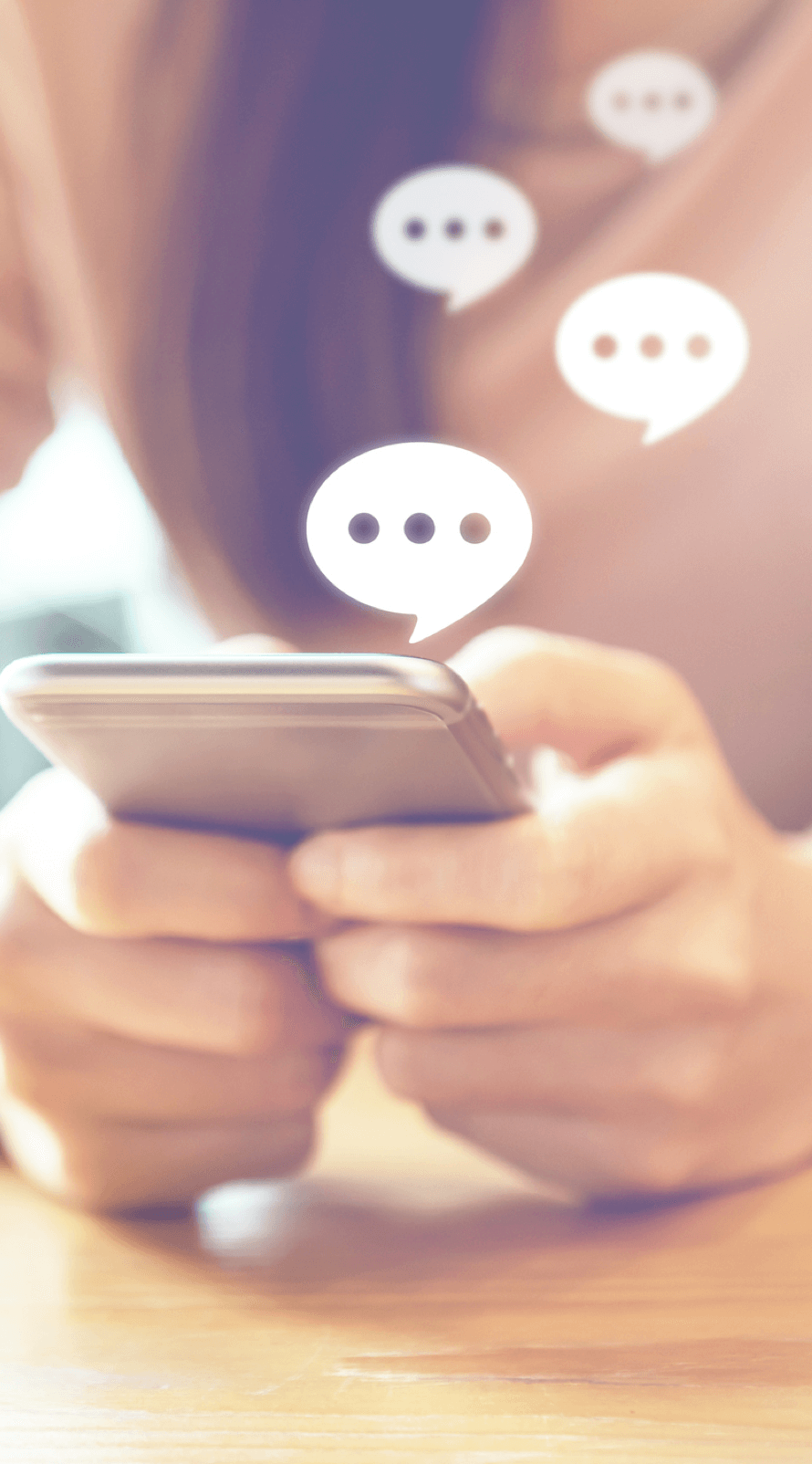 Close up of customer hands as they message with customer service team member