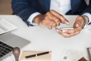 Business person using phone.