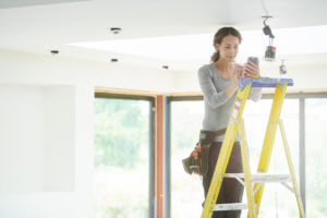 Woman on ladder.