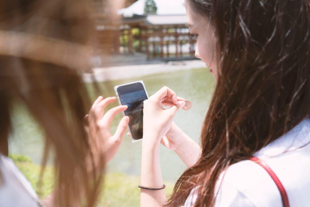 Women looking at phone.