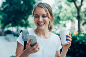 Woman reading text on phone