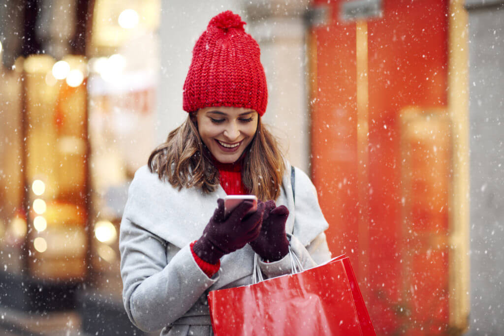 Woman and holiday sms on phone