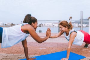 Trainer and client working out.