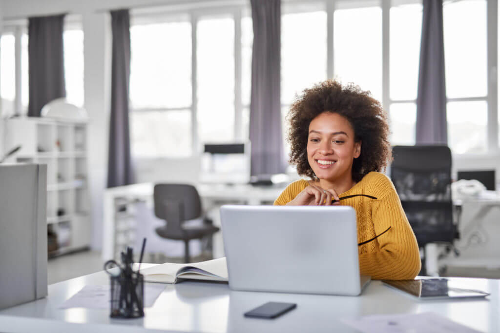 Sales person at computer.