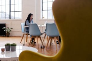 Woman working at table.