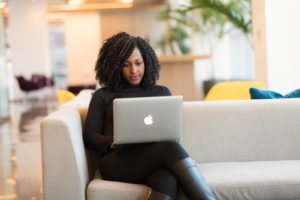 Woman using business SMS on her computer