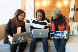 Women working on laptops.