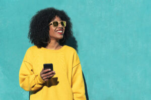 Woman using omnichannel messaging to check in with a company