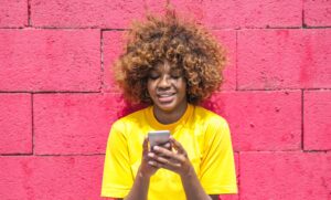 Woman happily receiving SMS customer engagement content 