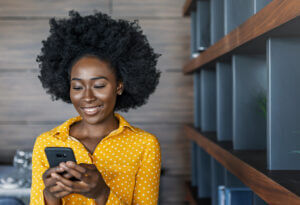 Businesswoman including her SMS signature in a text