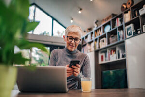 Smiling woman using omnichannel messaging to connect with a brand