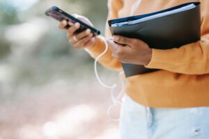 Person using her phone to complete an SMS opt in