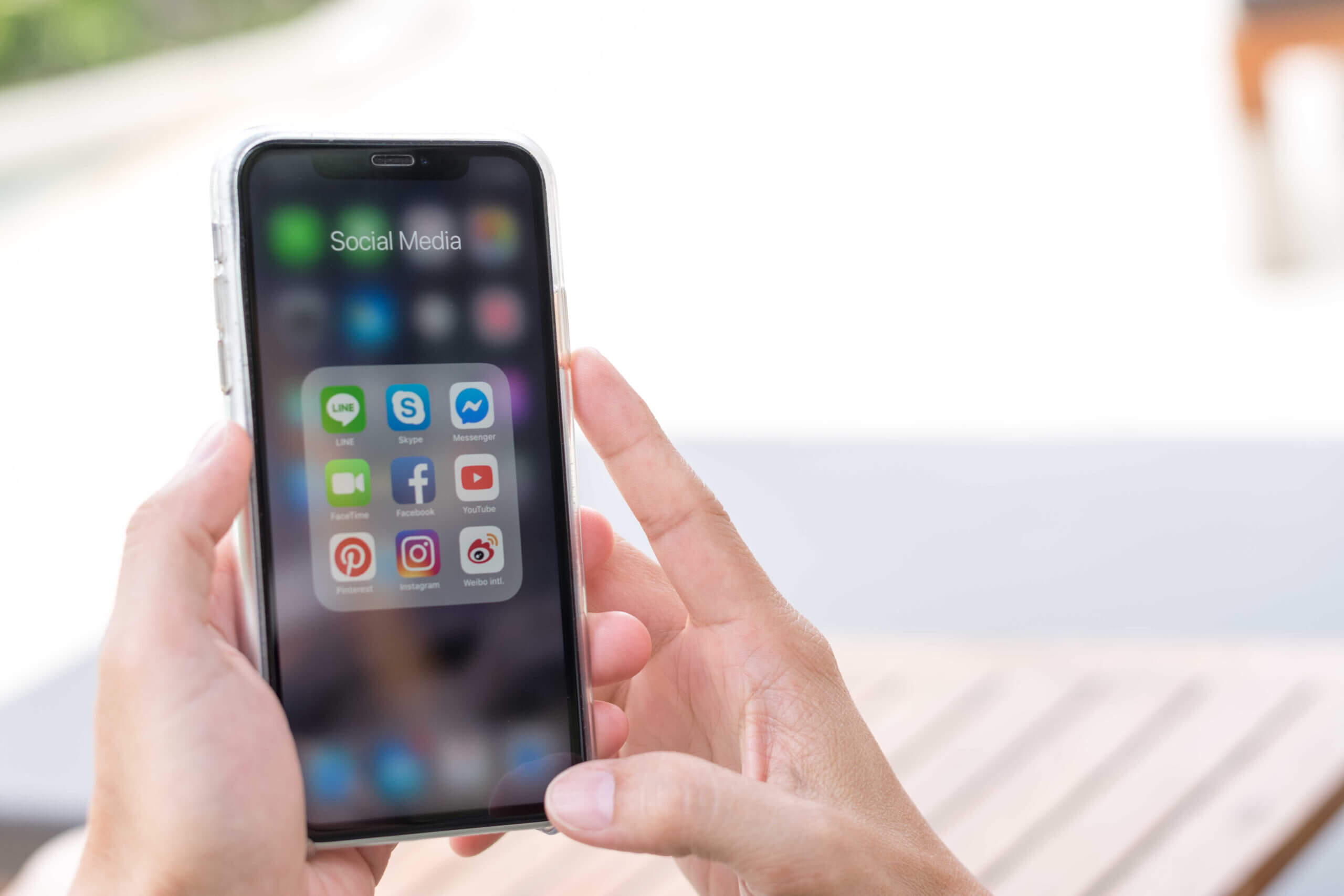 Phone screen showing different apps used for conversational customer engagement