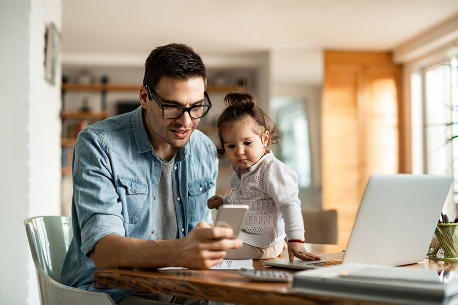 A father sitting with his child - one example of customers texting at home