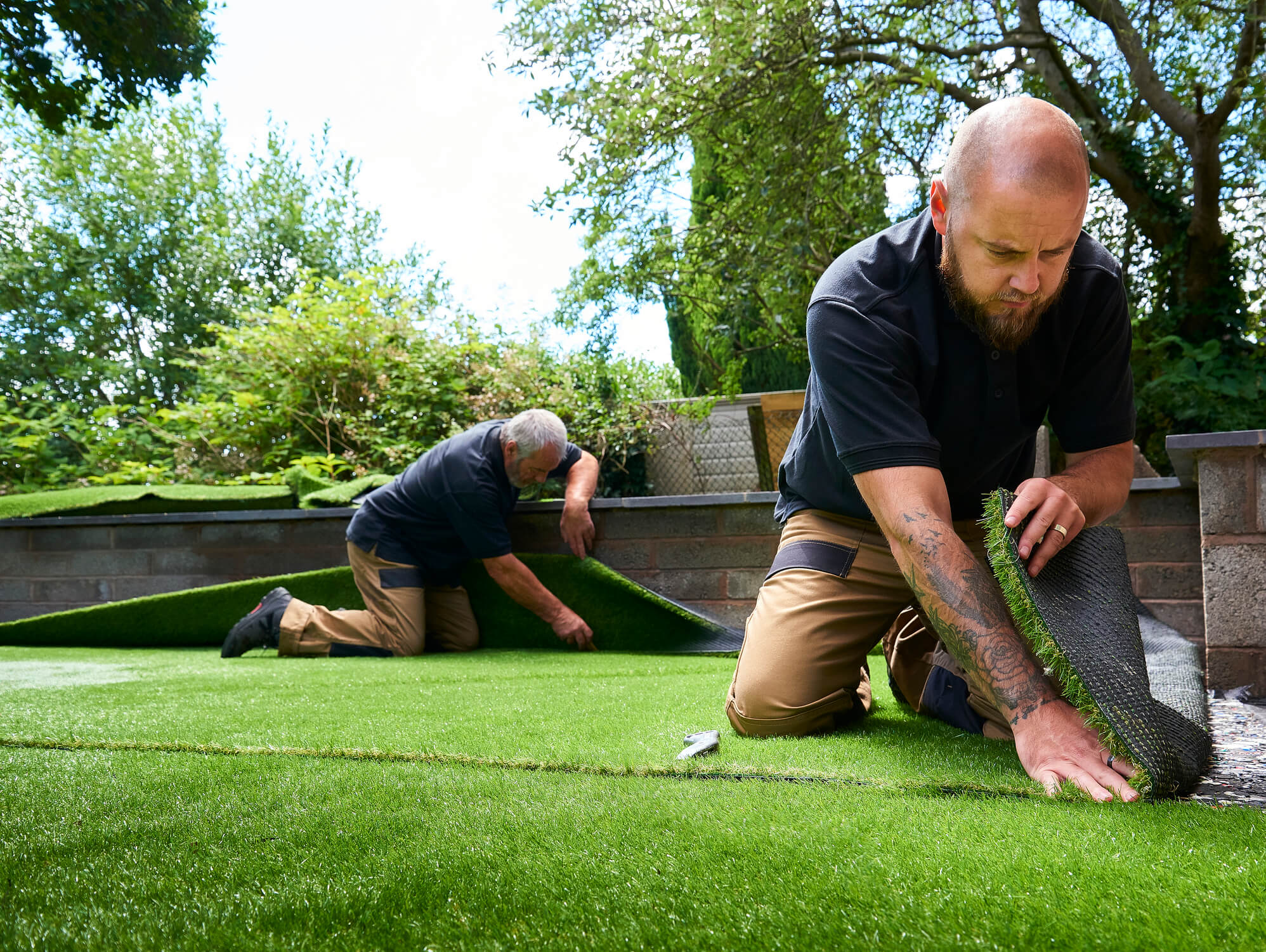 Landscapers laying grass