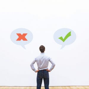 Man looking at checkmark and x mark, the dos and don't of conversational customer engagement