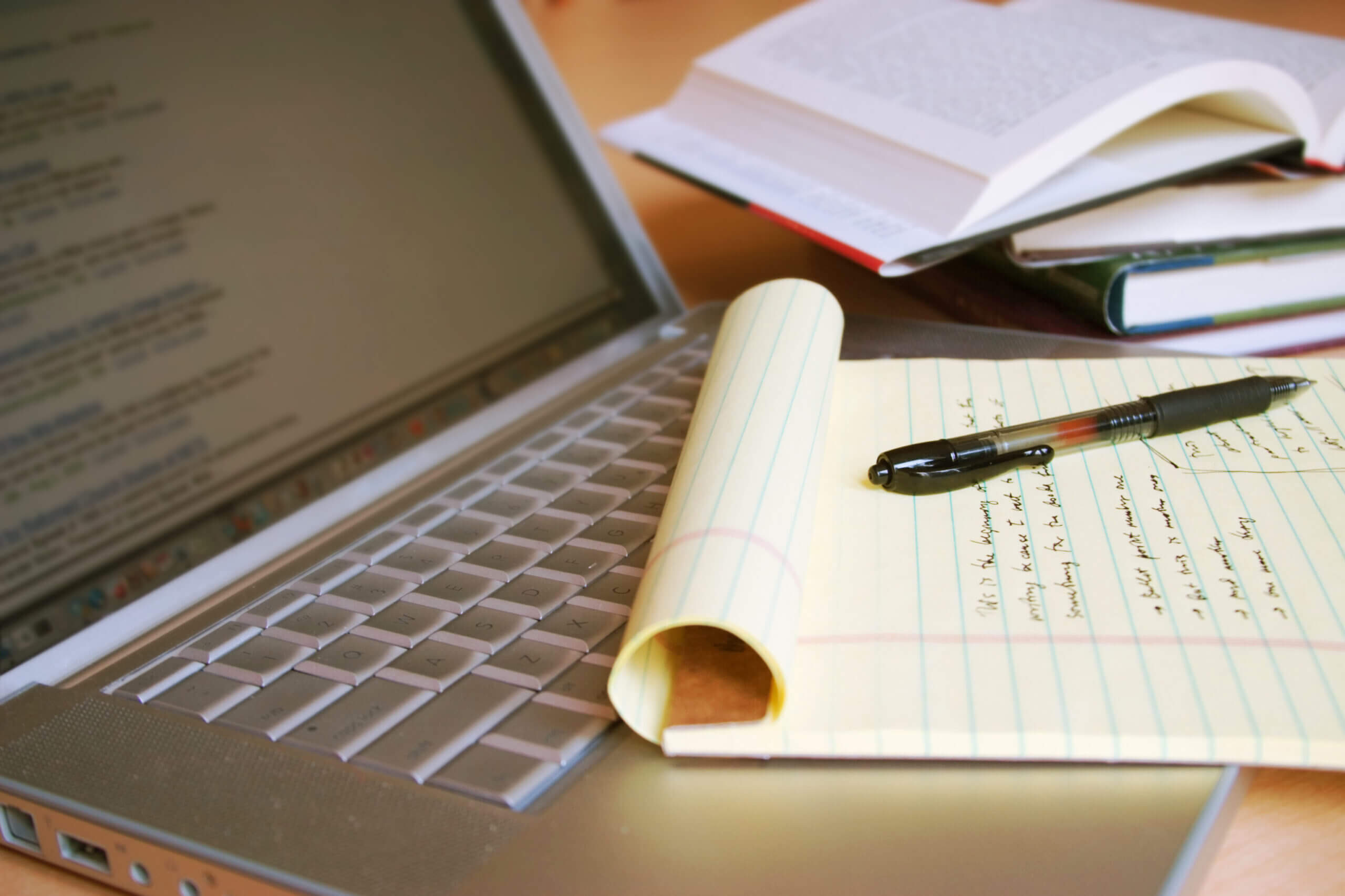 Notebook and pen on keyboard