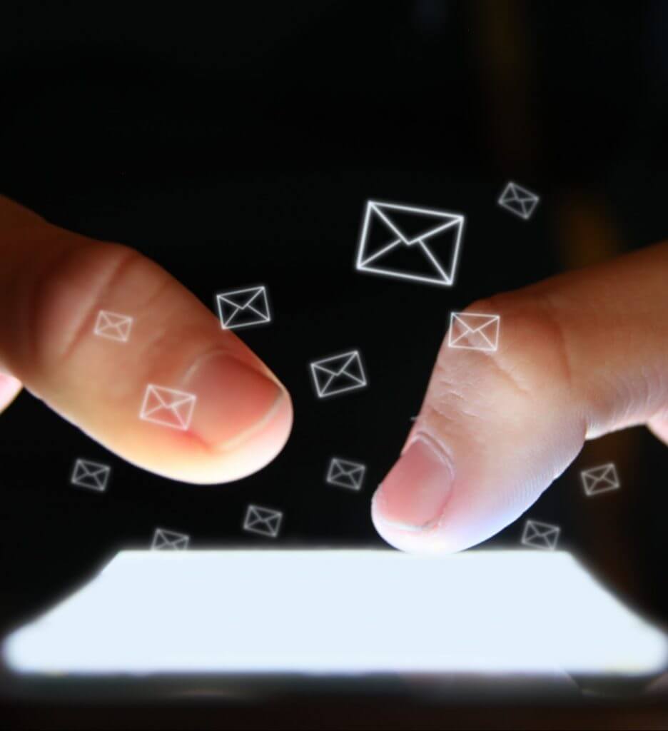 Close-up of hands typing on screen using conversational customer engagement
