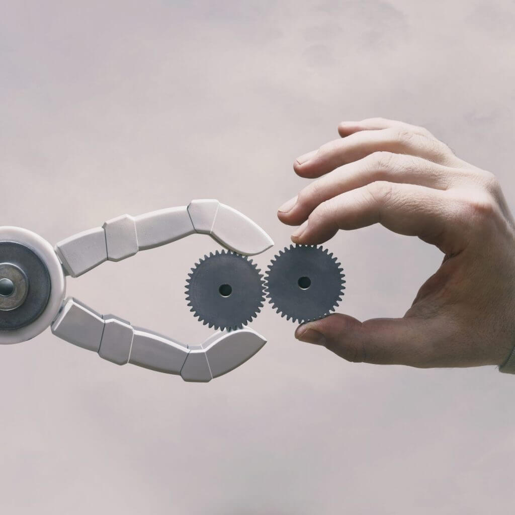 Robot and human hands signifying automated replies