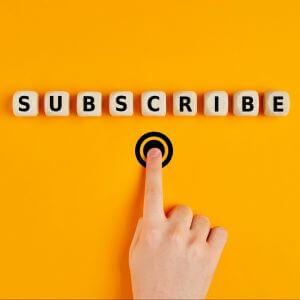 Hand pressing subscribe to signify sms list building
