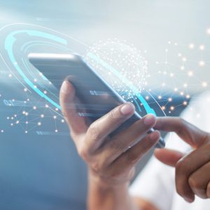 Hand holding mobile phone to use Conversational Customer Engagement with App Integrations
