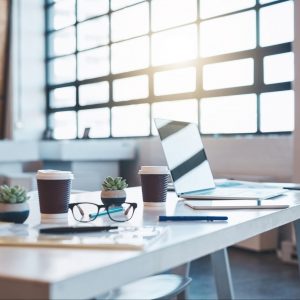 Image of an empty office to signify need for business SMS while working remotely