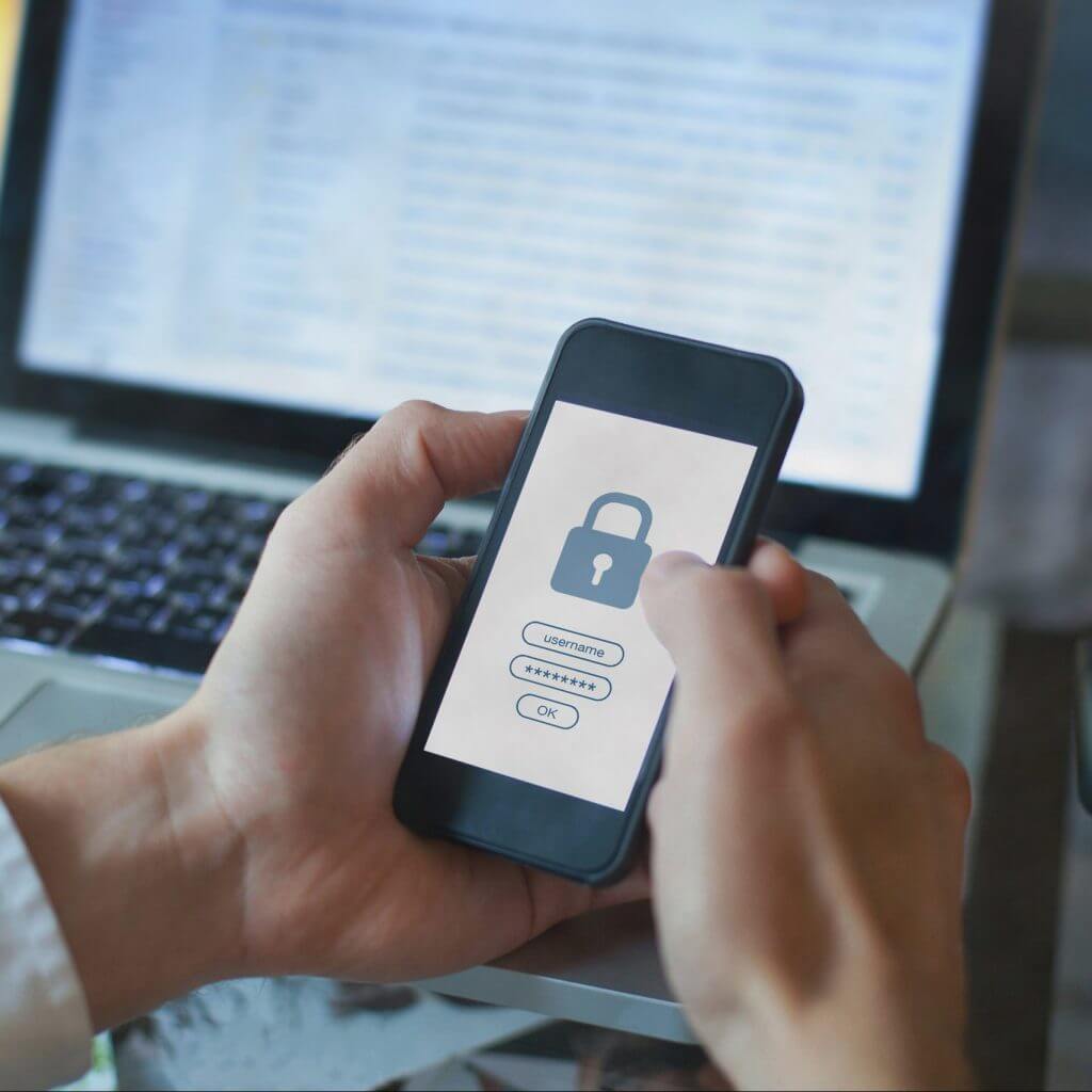 Hands holding phone with lock icon to show SMS security