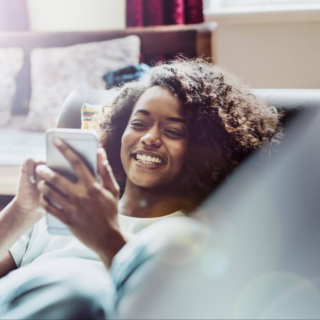 Woman texting a business that is using SMS templates