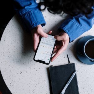 Hands holding phone using Instagram Business Messaging