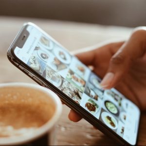 Coffee and hand on table using Instagram business messaging