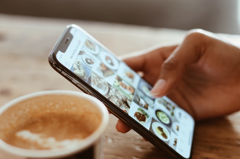 Coffee and hand on table using Instagram business messaging