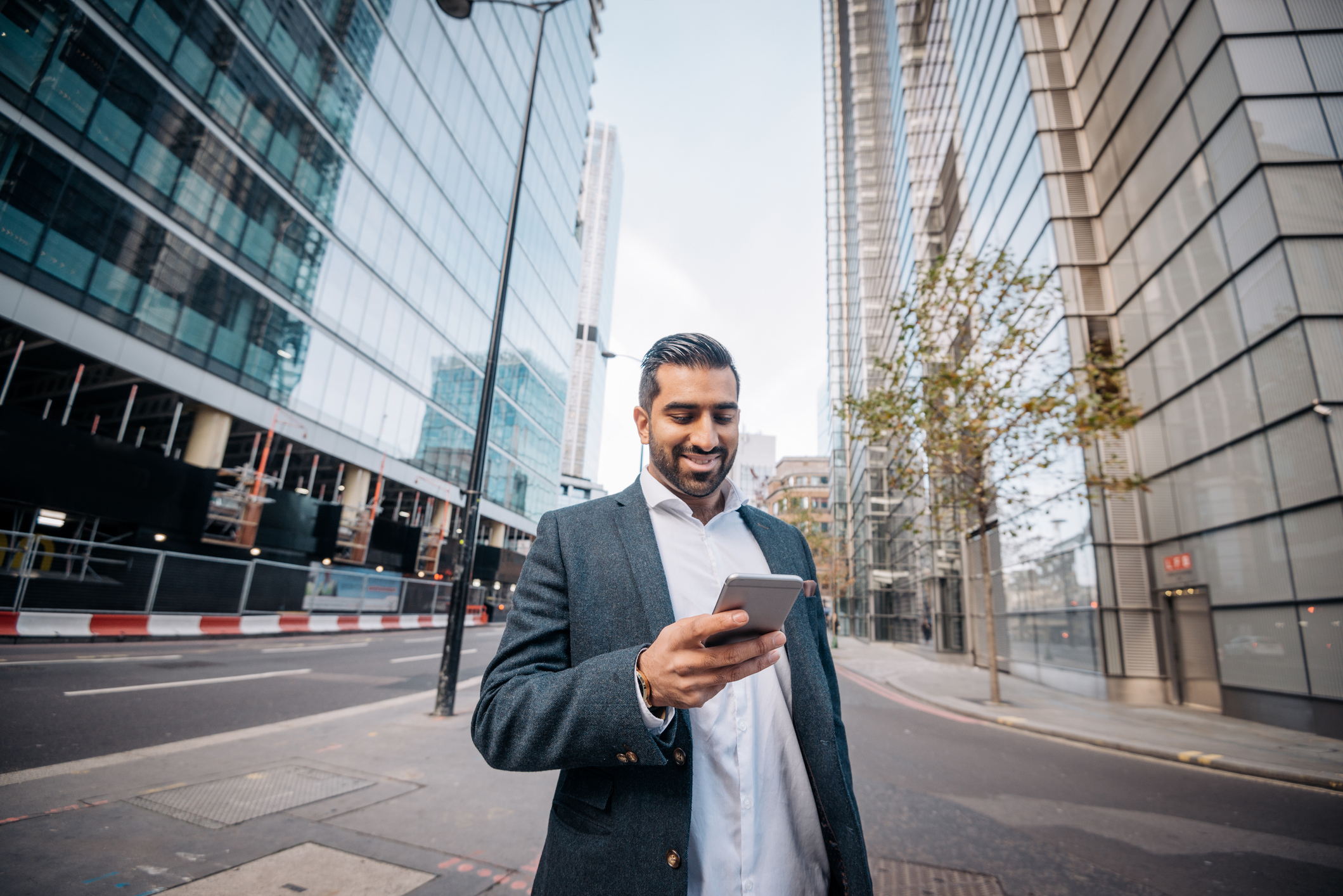 Salesman walking down street and texting with conversational sales